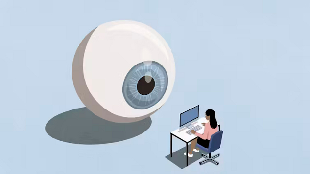 a camera eye focused on a worker at her desk.